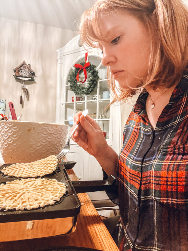 Women making pizzelle cookies